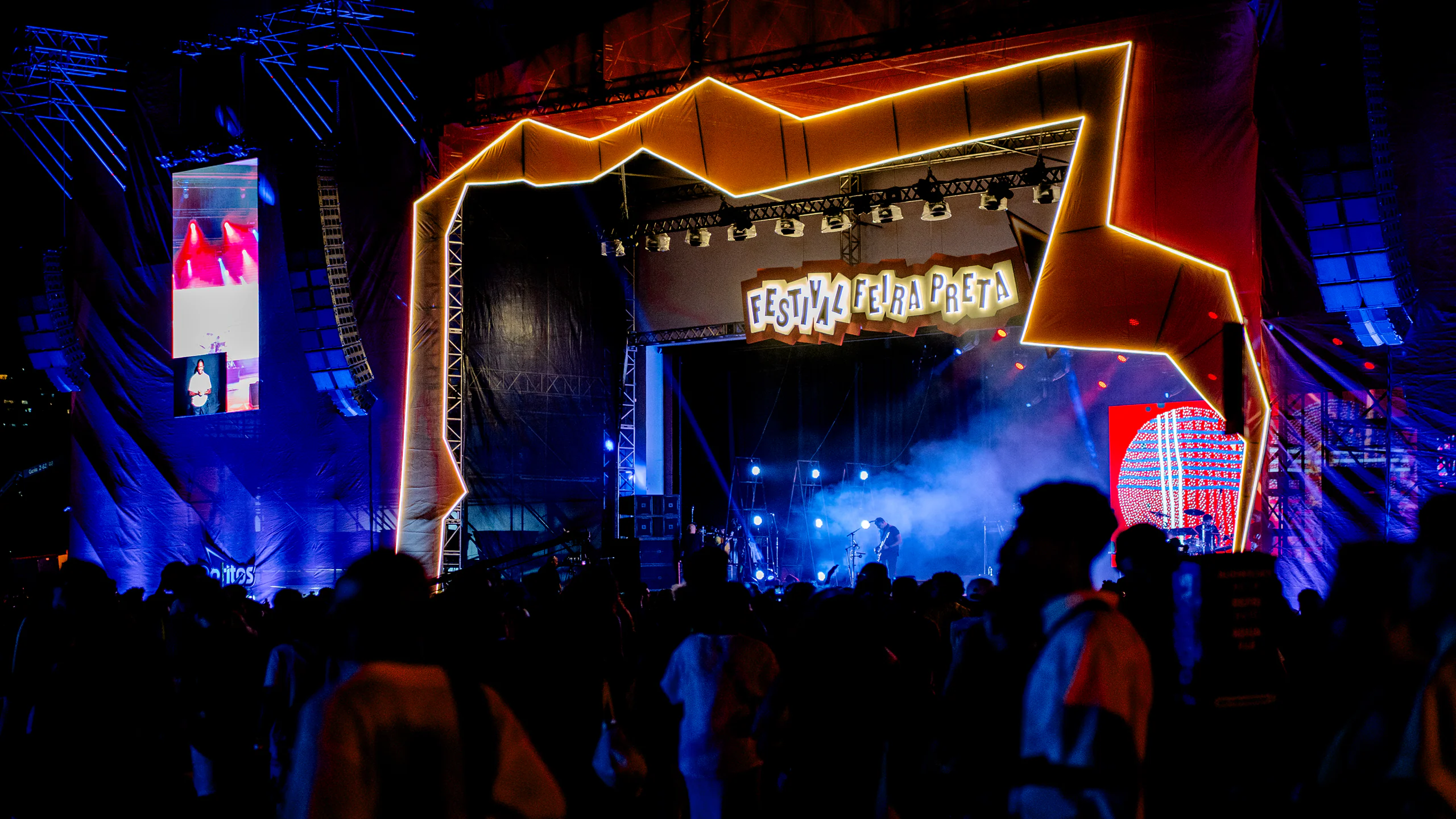 The stage at night, lit in red and blue