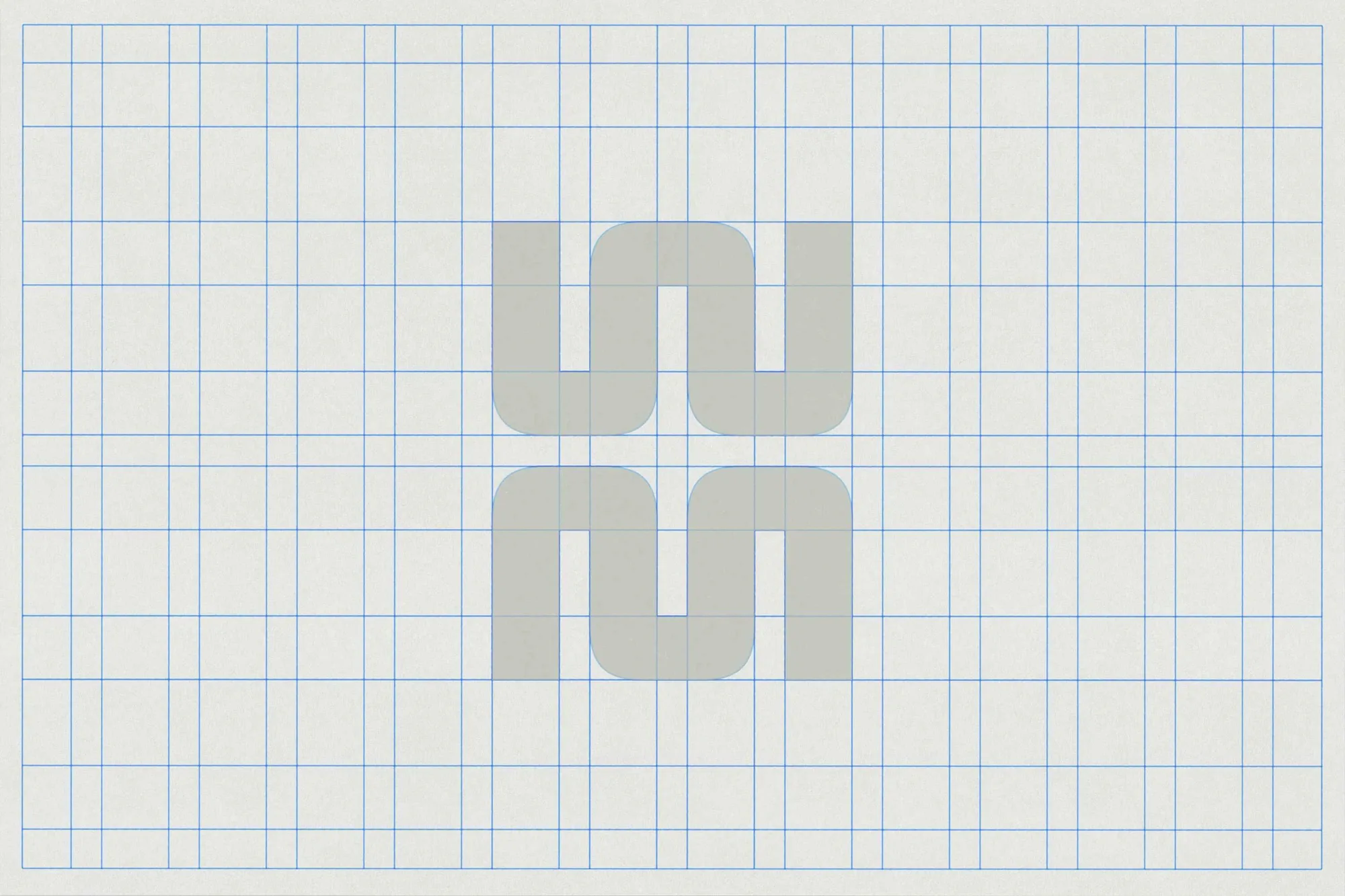The monogram drawn over a blue grid
