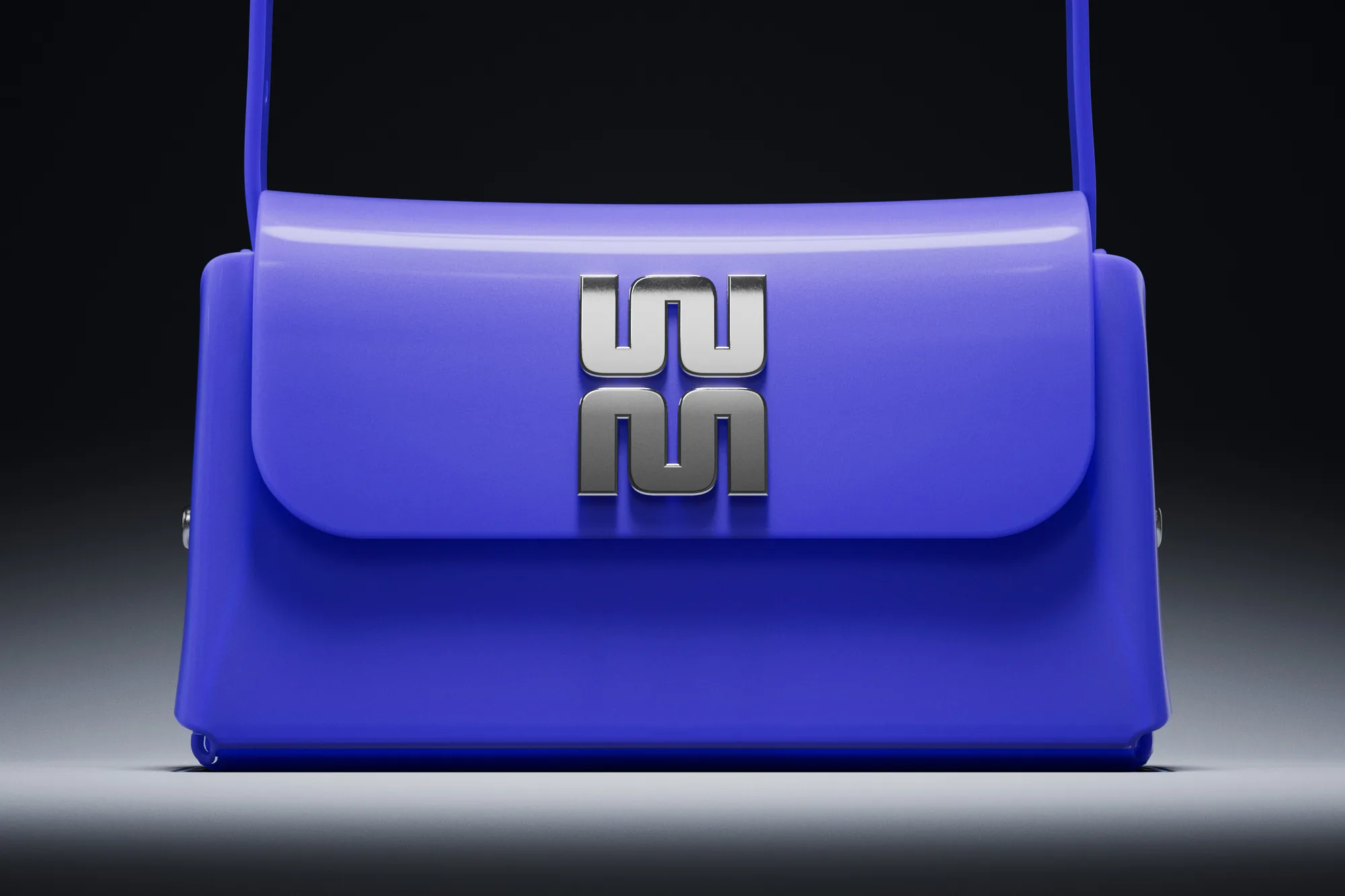 A blue Melissa bag with a silver monogram clasp