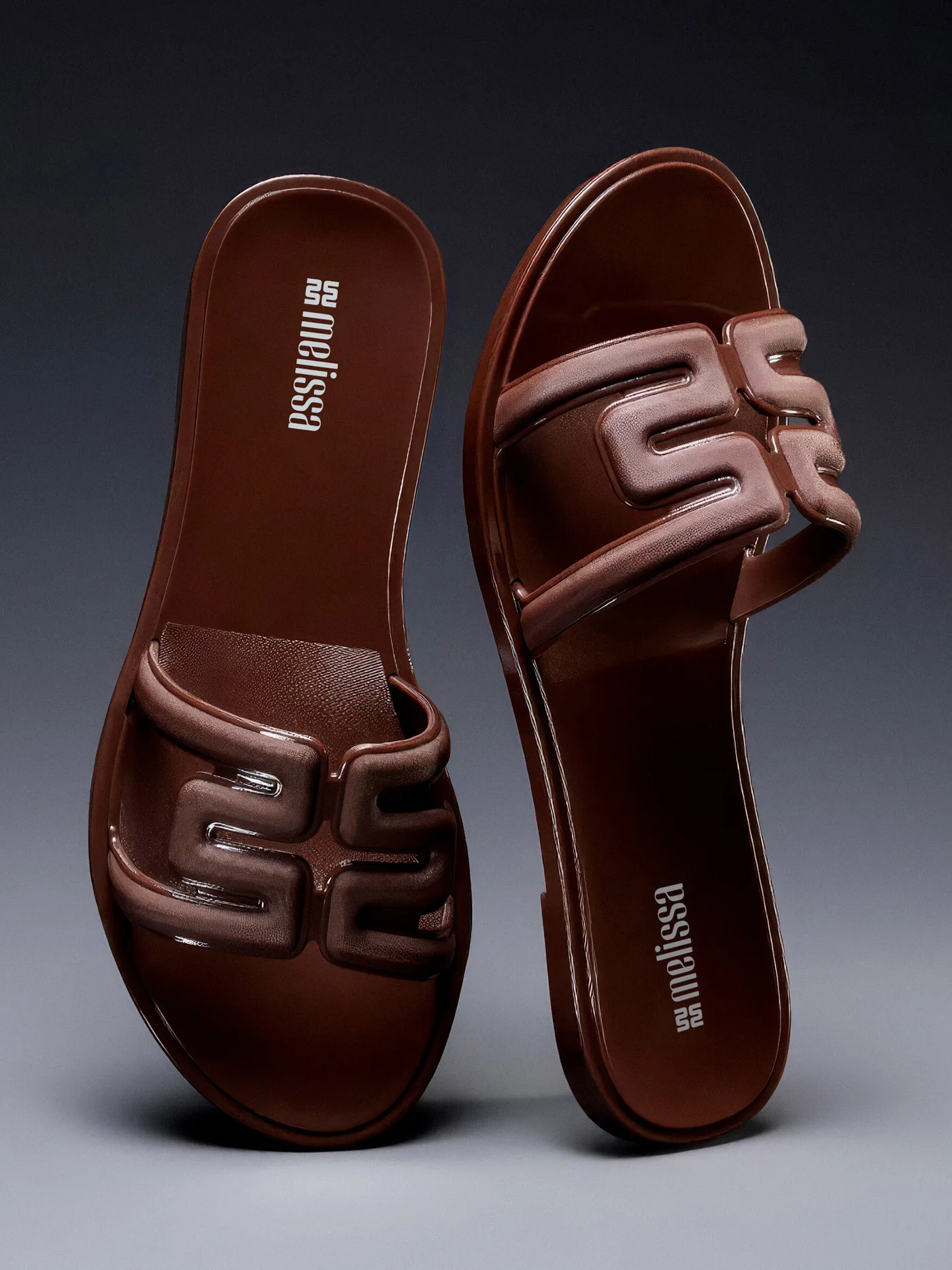 Brown slides with the monogram on the strap